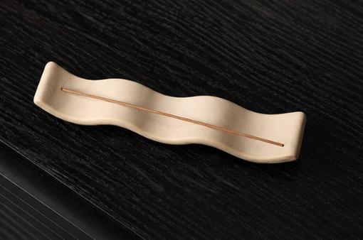 The Ripple ceramic incense holder by Shyang Studio — handmade in China, sand-toned matte stoneware in the silhouette of distant hills