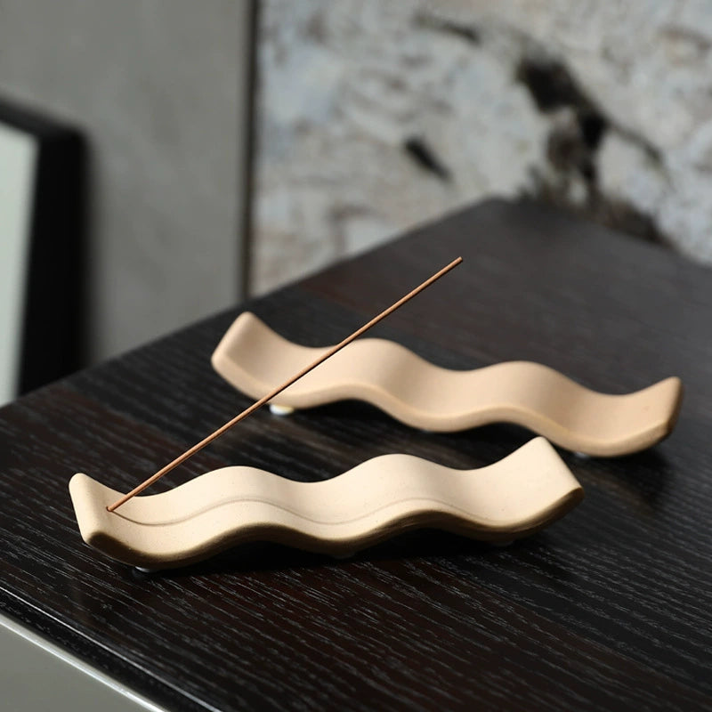 The Ripple handmade ceramic incense holder by Shyang Studio — sand-toned matte stoneware shaped like distant hills, set of 2