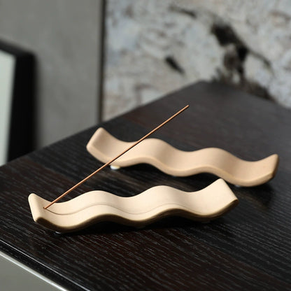 The Ripple handmade ceramic incense holder by Shyang Studio — sand-toned matte stoneware shaped like distant hills, set of 2